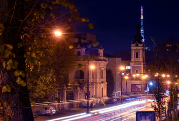 Fototapeta na wymiar Lviv at night, ukrainian city long exposure photo, road, transport lights, lviv old city in the evening