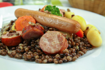 sausage and lentils dish on a wooden table