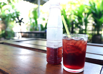Herbal drinks and ice glasses on a wooden table