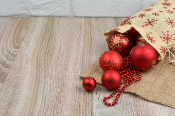 The concept of New Year's gifts. A wooden background. Place to sign. Card.