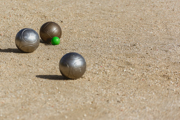 bocce balls on the floor of the game court