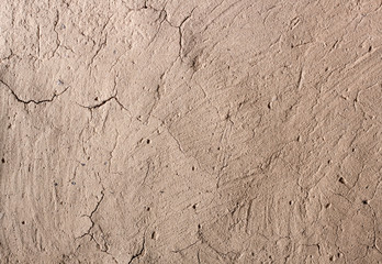 Old cob wall with cracked surface