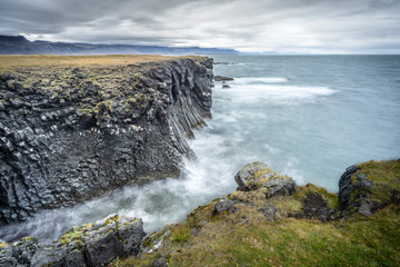 basaltic columns near Arnastapi at the wild rocky coast of Snaefellsness peninsula in western Iceland