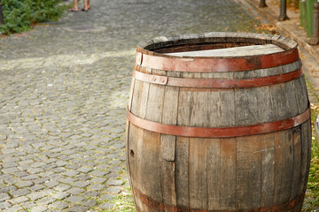 Fototapeta premium old wine barrel on the paving stones