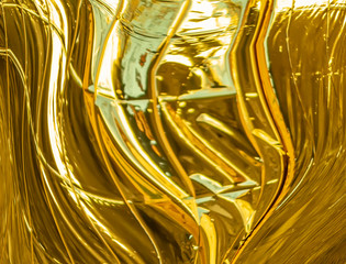 Golden metallic background with curves and waves
