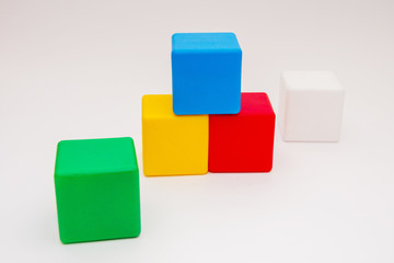Children's colorful cubes on a white background, children's toys, educational games.