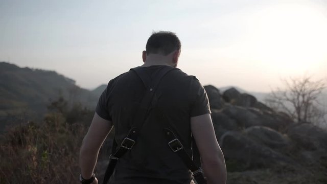Photographer at sunset with camera