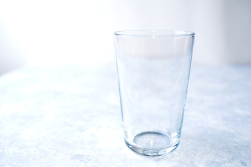 Empty glass isolated on a blue background