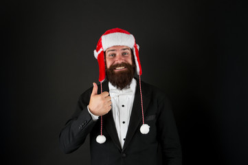 Fototapeta na wymiar Business santa wish you financial growth. Business corporate. Man with beard in smart suit and Santa hat. Businessman Santa in jacket. Christmas party concept. Feeling warmth. Funny winter hat