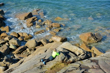 Young boy who is watching the sea in Brittany. France