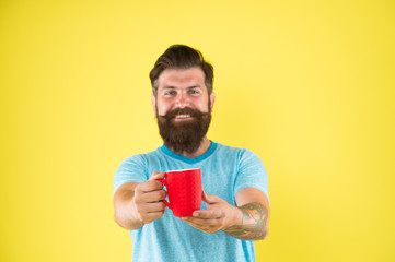 Hipster stylish barista yellow background. Herbal tea. Aromatic beverage. Understand value taste really great cup of coffee. Coffee shop. Bearded man satisfied drink morning coffee. Energy concept