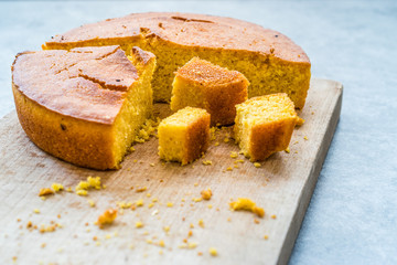 Fresh Baked Corn Bread Slices on Wooden Board.
