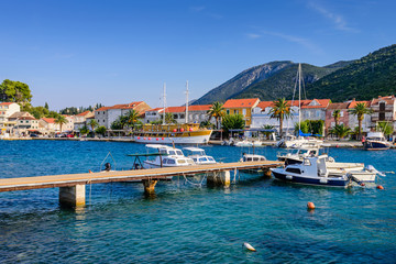 Fototapeta na wymiar Colorful fishing boats in the Harbor of Trpanj town, Peljesac Peninsula, Dalmatia region, Croatia. The picturesque coast of the Adriatic sea in Trpanj town
