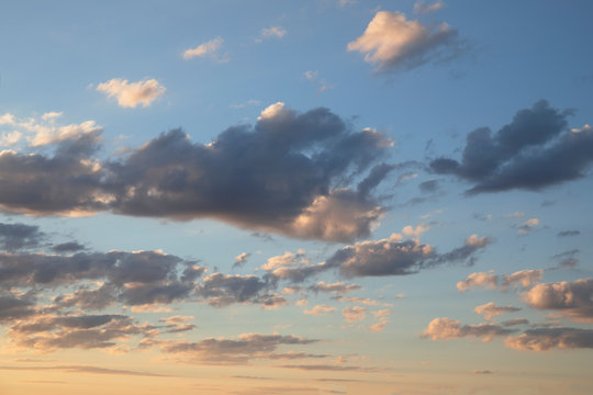 Amazing dark grey and white clouds during the sunset contrasted against a lighter color sky