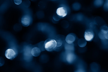 Blue abstract christmas new year bokeh lights background in blue tones