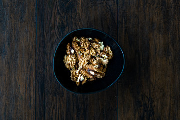 Walnut Kernels and Whole walnuts in Porcelain Bowl.