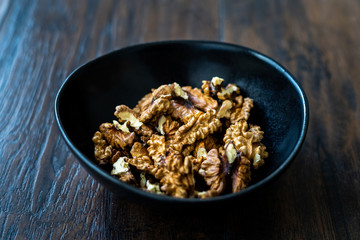 Walnut Kernels and Whole walnuts in Porcelain Bowl.