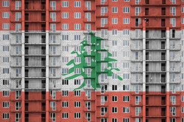 Lebanon flag depicted in paint colors on multi-storey residental building under construction....