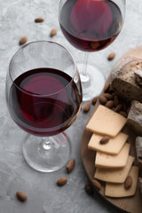 glass of red wine with cheese and bread
