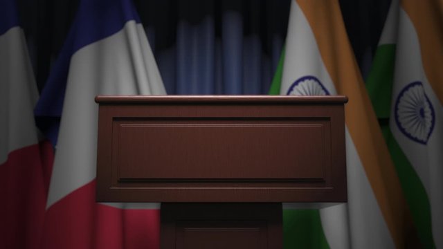 Flags of France and India and speaker podium tribune. Political event or negotiations related conceptual 3D animation
