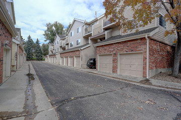 Condominiums apartments townhomes back exterior with garages