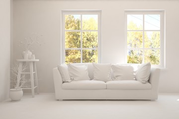 Stylish room in white color with sofa and autumn landscape in window. Scandinavian interior design. 3D illustration