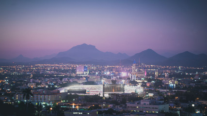 sunset on the city mountains and baseball park