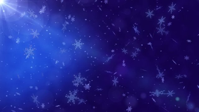 Beautiful loopable abstract winter snow background with falling snowflakes and floating blurry glitter particles lights. 4K seamless loop video footage of the snowfall.