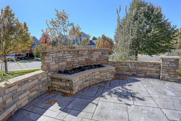 Beautiful residential  seculded front patio on suburban street with firepit