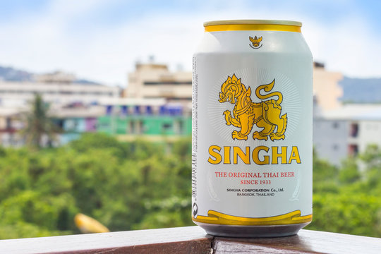 new bottle of Singha beer Original on the background of nature