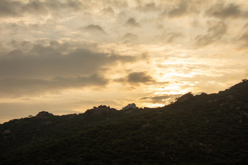 Beautiful view of the sky during sunset behind the mountains