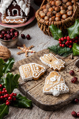 Three Christmas gingerbread cookies on a cutting board
