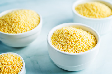 Dried millet porridge in the white bowl