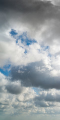 Fantastic clouds against blue sky, panorama