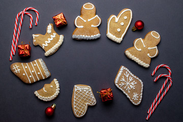 Cookies background. Christmas homemade gingerbread cookies on dark. Celebration cooking Winter concept. New year and christmas postcard or invitation