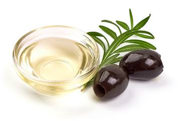 Olive oil in a bowl, isolated on white background
