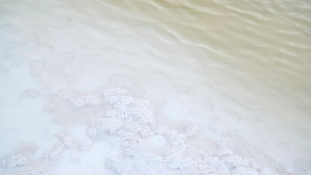 A shore of the Bascunchak salt lake with a largest reserve of salt in the world