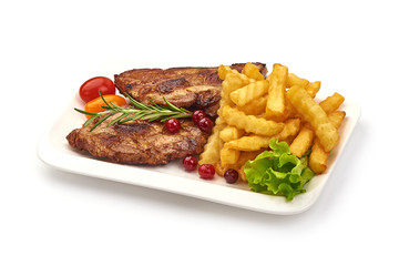 Grilled homemade pork ribs, barbecued meat with french fries, isolated on white background