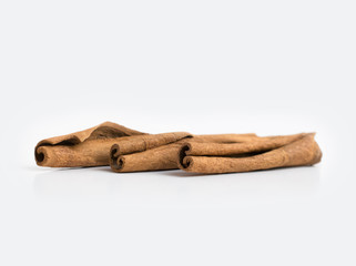 Several cinnamon sticks isolated on grey background.