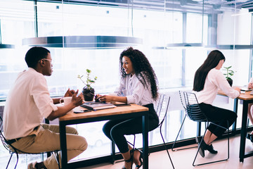 Black couple talking in cafe