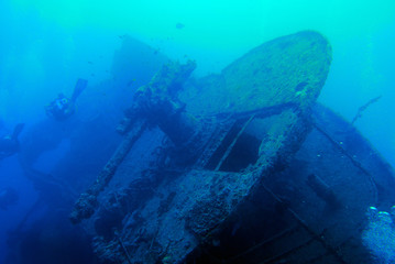 Scuba diving to wreck propellor on bottom of the ocean.