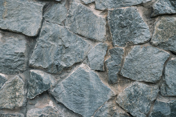 Stone wall. Wall made of stones.