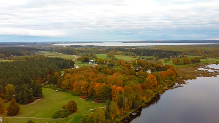 Fototapeta na wymiar Doles Sala is the Second Largest Island in Latvia. This is a Peninsula in the Daugava River, Near the Borders of Riga. Aerial Dron Shoot. Sunny Autumn Day.