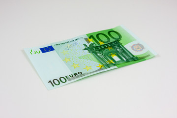 Obraz na płótnie Canvas A hundred euro banknote on white background