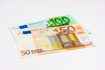 Two different euro banknotes on white background