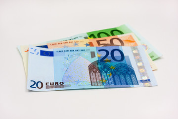 Three different euro banknotes on white background