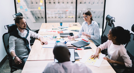 Ambitious work team during briefing in office