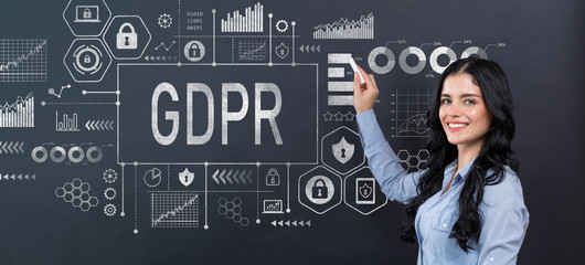 GDPR concept with young woman writing on a blackboard