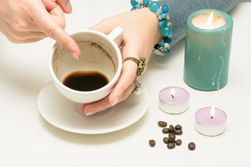 Coffee grounds fortune telling close up. Fortune teller with a cup of coffee.
