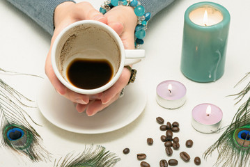 Coffee grounds fortune telling close up. Fortune teller with a cup of coffee.